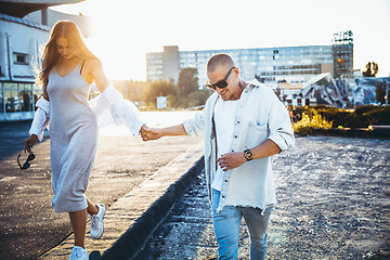 Image showing Tanned young caucasian couple, modern lovestory in film grain effect