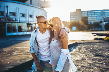 Image showing Tanned young caucasian couple, modern lovestory in film grain effect