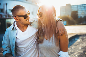 Image showing Tanned young caucasian couple, modern lovestory in film grain effect