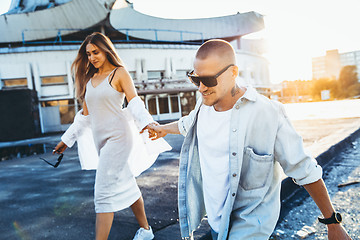 Image showing Tanned young caucasian couple, modern lovestory in film grain effect