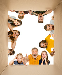 Image showing Shocked people opening the biggest postal package