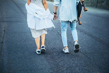 Image showing Tanned young caucasian couple, modern lovestory in film grain effect