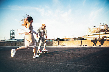 Image showing Tanned young caucasian couple, modern lovestory in film grain effect