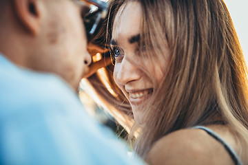 Image showing Tanned young caucasian couple, modern lovestory in film grain effect