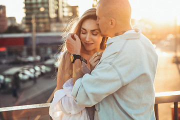 Image showing Tanned young caucasian couple, modern lovestory in film grain effect