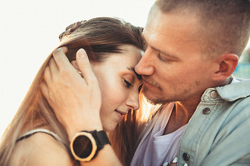 Image showing Tanned young caucasian couple, modern lovestory in film grain effect