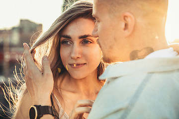 Image showing Tanned young caucasian couple, modern lovestory in film grain effect