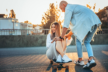 Image showing Tanned young caucasian couple, modern lovestory in film grain effect