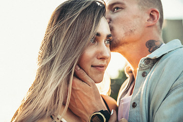 Image showing Tanned young caucasian couple, modern lovestory in film grain effect