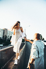 Image showing Tanned young caucasian couple, modern lovestory in film grain effect