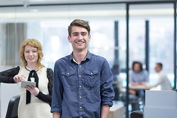 Image showing Business People Working With Tablet in startup office