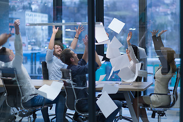 Image showing startup Group of young business people throwing documents