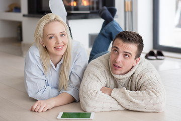 Image showing Young Couple using digital tablet on cold winter day