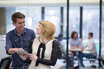 Image showing Business People Working With Tablet in startup office