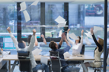 Image showing startup Group of young business people throwing documents