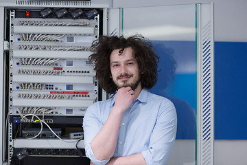 Image showing business man engeneer in datacenter server room