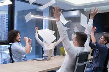 Image showing startup Group of young business people throwing documents