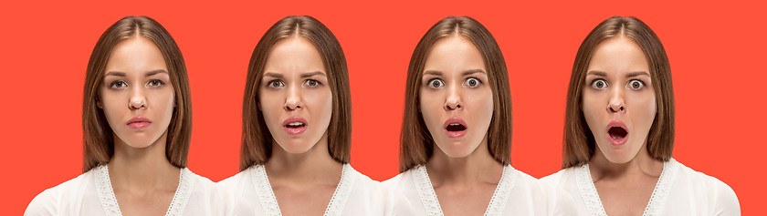 Image showing Beautiful woman looking suprised isolated on red