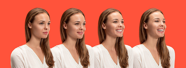 Image showing The happy business woman standing and smiling against red background.