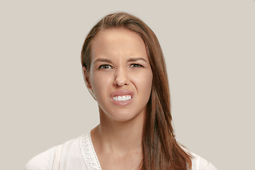 Image showing Annoyed young woman feeling frustrated with something. Human facial expressions, emotions and feelings.