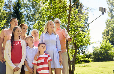 Image showing happy family taking selfie in summer garden