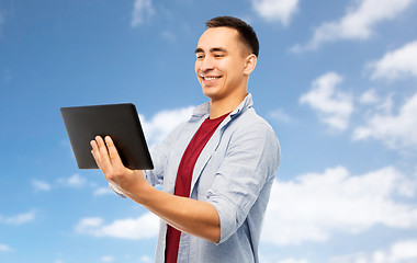 Image showing happy young man with tablet computer