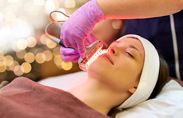 Image showing young woman having face microdermabrasion at spa