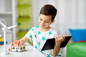 Image showing boy with tablet, toy house and wind turbine