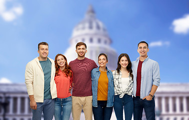 Image showing group of smiling friends over capitol building