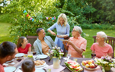 Image showing happy family having dinner or summer garden party