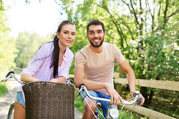 Image showing happy couple with bicycles at summer park