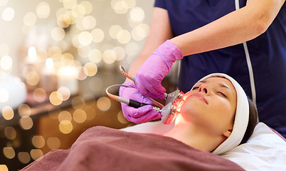 Image showing young woman having face microdermabrasion at spa