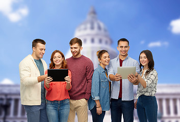 Image showing friends with tablet pc over capitol building