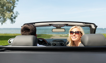 Image showing happy man and woman driving in cabriolet car