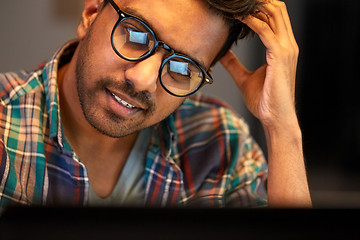 Image showing close up of creative man working at night office