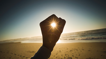 Image showing Holding sun