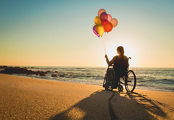 Image showing Woman on a wheelchair