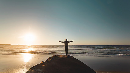 Image showing Woman with arms raised