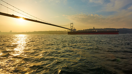 Image showing Turkey, Istanbul, Bosphorus Channel, Bosphorus Bridge, an cargo ship under the Bridge.