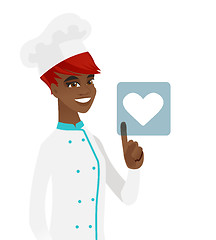 Image showing Young african chef pressing web button with heart.