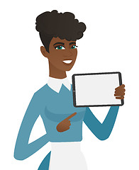 Image showing Young african cleaner holding tablet computer.