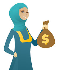 Image showing Young muslim business woman holding a money bag.