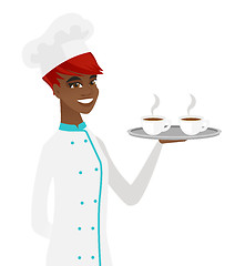 Image showing Young african-american chef holding tray with cups