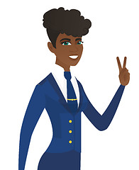 Image showing Arican stewardess showing the victory gesture.