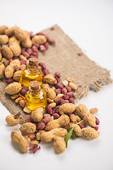 Image showing Natural peanut with oil in a glass