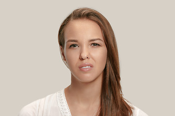 Image showing Annoyed young woman feeling frustrated with something. Human facial expressions, emotions and feelings.