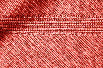 Image showing Closeup macro texture of knitted cotton waffle fabric in a color of the year 2019 Living Coral Pantone.