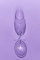 Image showing Empty wine glass on a violet background