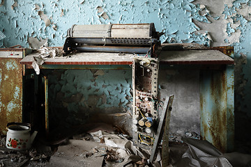 Image showing Damaged machinery on table