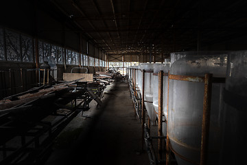 Image showing Abandoned industrial interior with breeding tanks